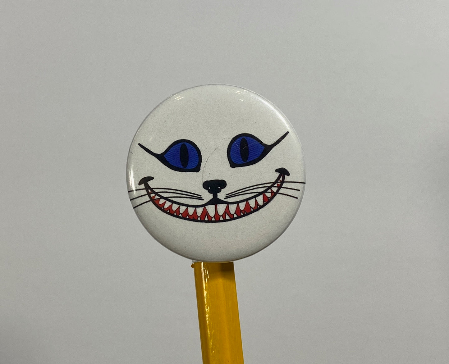 Grinning Cheshire Cat Flair Pin Button 1.25" Round | Fantasy Design by TheGlassyLass.com