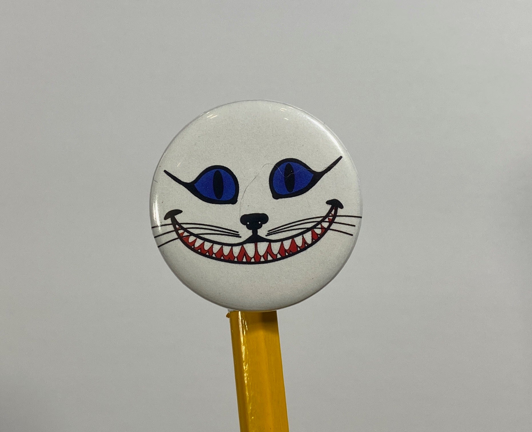 Grinning Cheshire Cat Flair Pin Button 1.25" Round | Fantasy Design by TheGlassyLass.com
